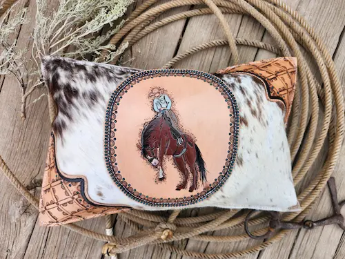 Handtooled leather throw pillow: bucking bronc