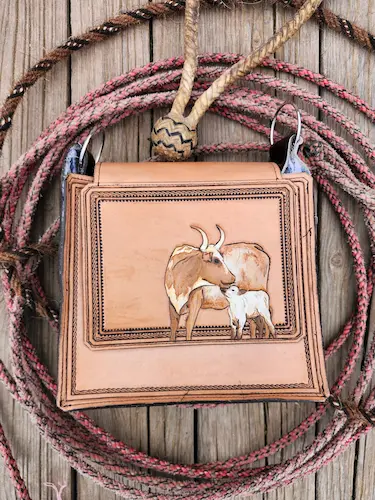 Handtooled leather bag with O-rings: longhorns