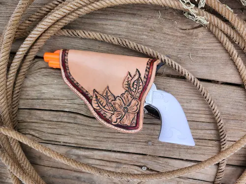 Handtooled leather gun holster