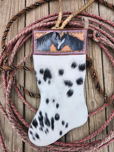 Handtooled leather stocking: two gray horses